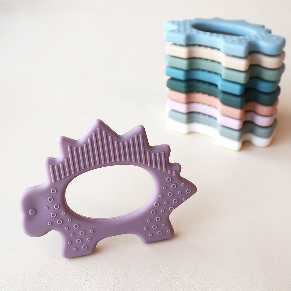 Juguete de dentición de dinosaurio