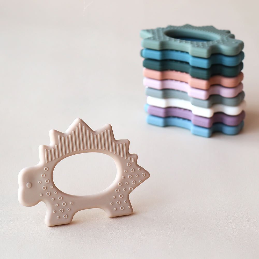 Juguete de dentición de dinosaurio