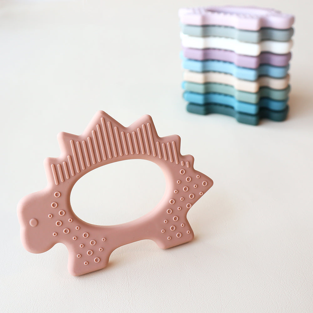 Juguete de dentición de dinosaurio