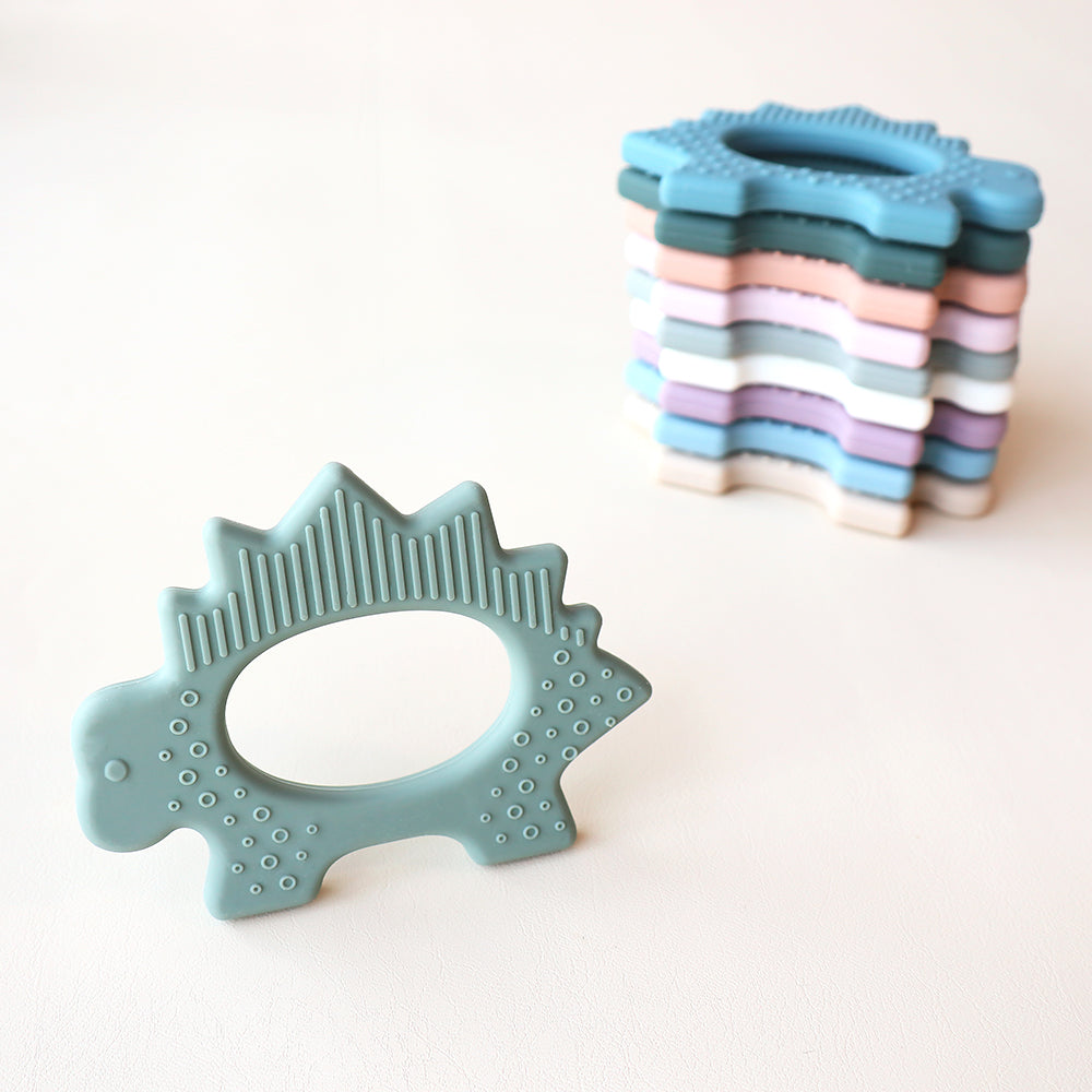 Juguete de dentición de dinosaurio